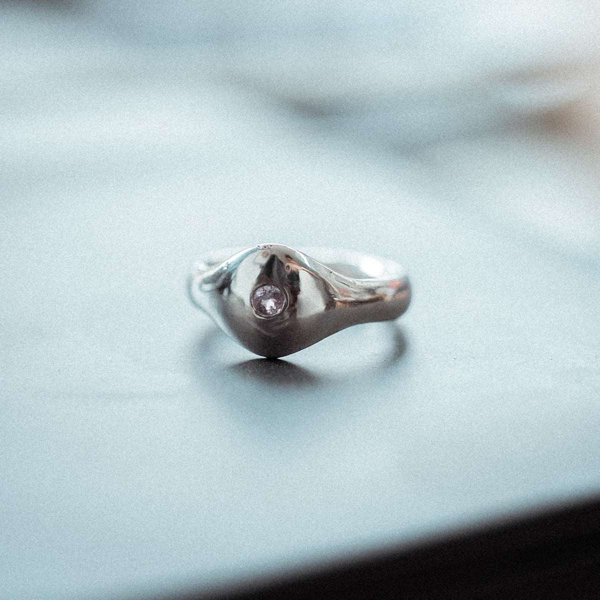 Side view of The Last Light sterling silver amethyst signet ring